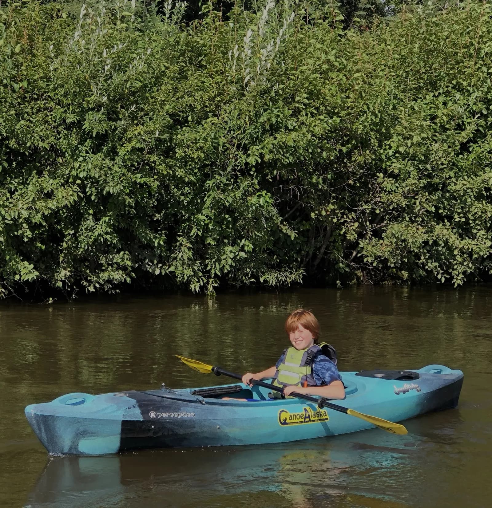 Kayakers on the scenic Lower Chena River float near Fairbanks
