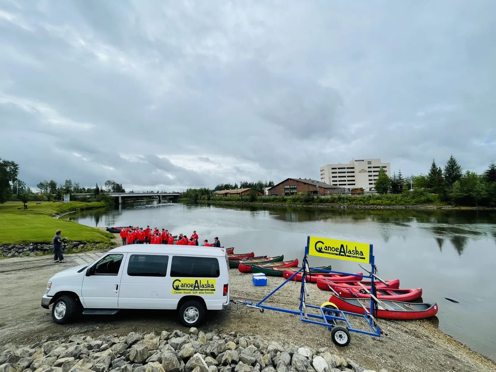 Large group canoe trip guests preparing for a Chena River outing